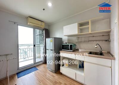 Small kitchen area with a view and appliances