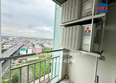 Balcony with city view and air conditioning units