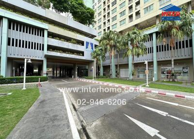 Apartment complex exterior with green landscaping