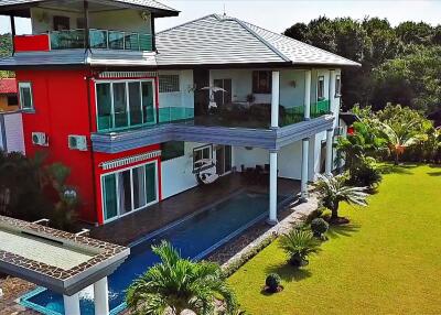 Modern two-story house with pool and large garden