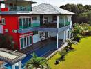 Modern two-story house with pool and large garden