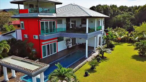 Modern two-story house with pool and large garden