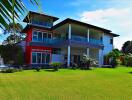 Exterior view of a modern house with a large lawn