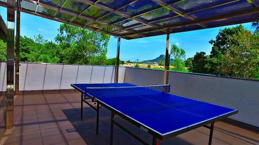 Terrace with table tennis setup and scenic view