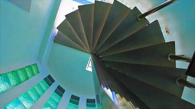 Spiral staircase with large windows