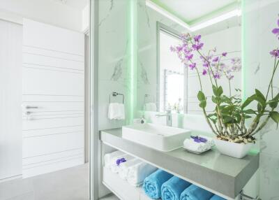 Modern bathroom with vanity and orchid