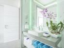 Modern bathroom with vanity and orchid