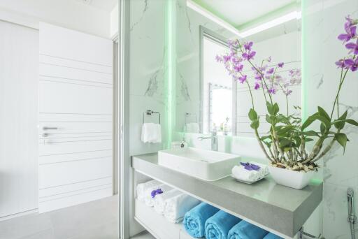 Modern bathroom with vanity and orchid