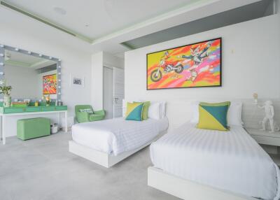 Modern bedroom with twin beds and colorful decor