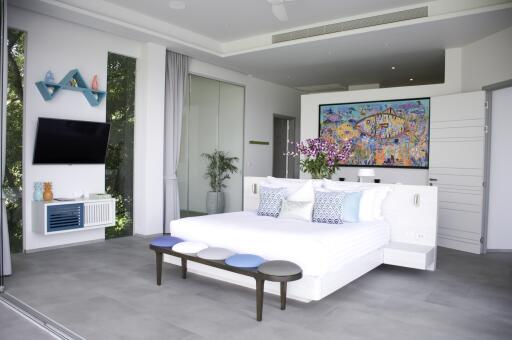 Modern bedroom with art and amenities