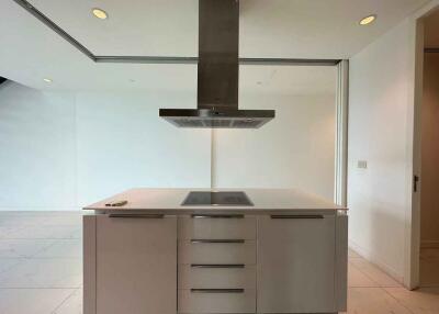 Modern kitchen with island and overhead range hood