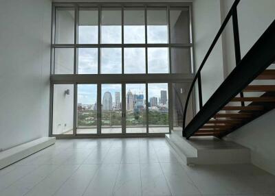 Modern living room with large windows and city view