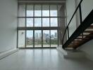 Modern living room with large windows and city view