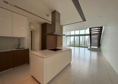 Modern kitchen with island and view of open living space