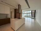 Modern kitchen with island and view of open living space