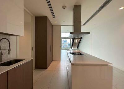 Modern kitchen with central island and integrated appliances