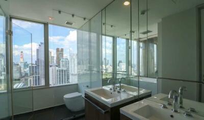 Modern bathroom with large windows and city view