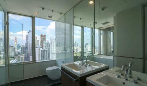 Modern bathroom with large windows and city view