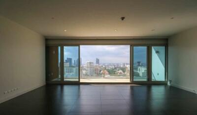 Living room with large windows and a city view