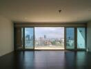 Living room with large windows and a city view