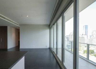 Modern living room with floor-to-ceiling windows and city view