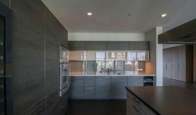 Modern kitchen with sleek cabinetry and built-in appliances