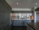 Modern kitchen with sleek cabinetry and built-in appliances