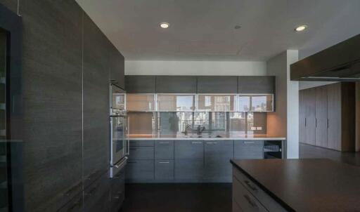 Modern kitchen with sleek cabinetry and built-in appliances