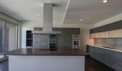 Modern kitchen with island and stainless steel appliances