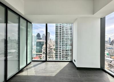 Bright and modern living area with large windows and city view