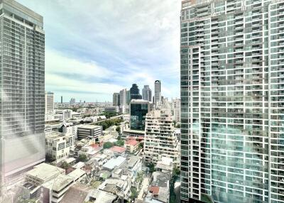 View of cityscape with tall buildings and residential area