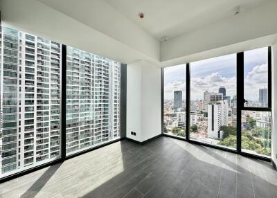 Modern living room with large windows and city view