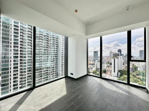 Modern living room with large windows and city view