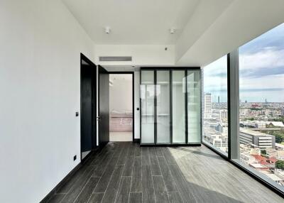 Modern living room with large windows and city view