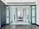 Modern bathroom with glass sliding doors and sleek black fixtures