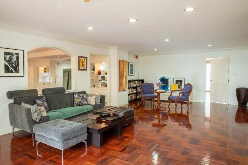 Spacious living room with modern furniture and wooden floor