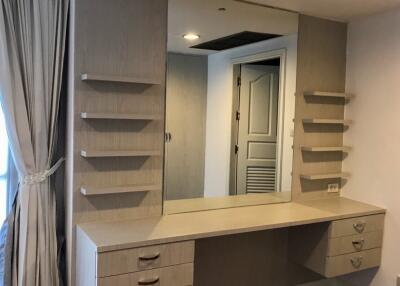 Bedroom vanity with mirror and shelves