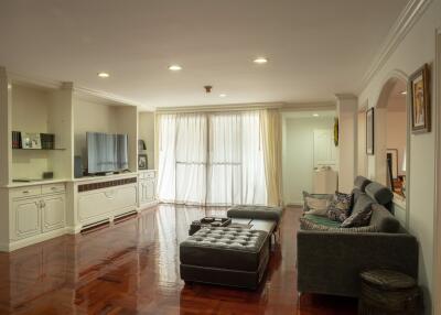 Spacious living room with hardwood floors and modern furnishings