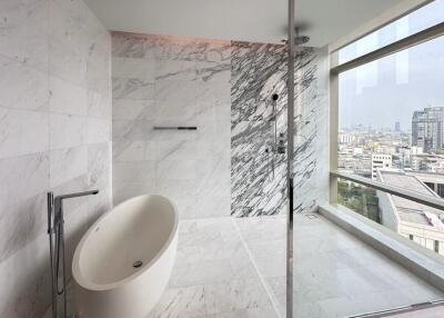 Modern bathroom with freestanding bathtub and walk-in shower