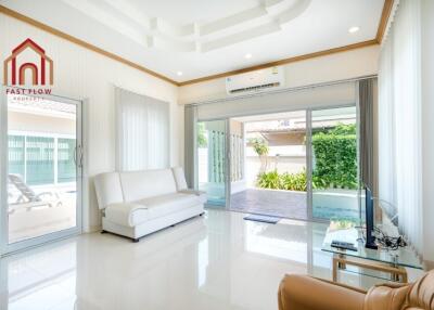 Modern living room with large windows and natural light