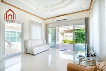 Modern living room with large windows and natural light