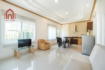 Spacious modern living room with dining and kitchenette