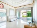 bright living room with white sofa and glass doors to patio