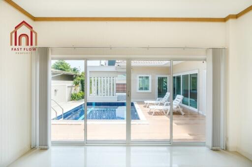 Spacious living area with a view of the swimming pool