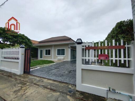 Front view of a residential house with a driveway