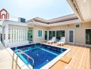 Outdoor private swimming pool area with sun loungers