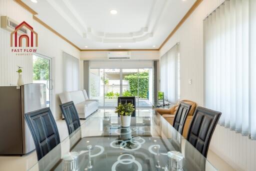 Modern living room with dining area and large windows