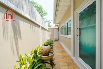 Outdoor passageway with plants and water fountain