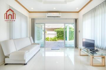 Bright living room with large glass doors.