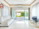 Bright living room with large glass doors.